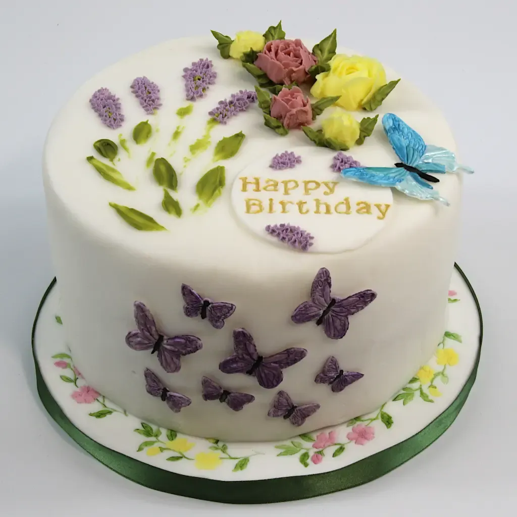 Birthday cake with lavender, flowers, and butterflies